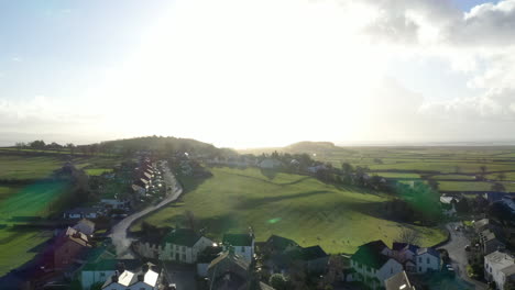 Aerial-rising-shot-of-a-countryside-village-in-the-lake-district-UK,-shot-on-a-bright-sunny-day