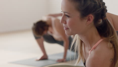 yoga class beautiful young woman stretching practicing poses enjoying warm up preparing for exercise in fitness studio