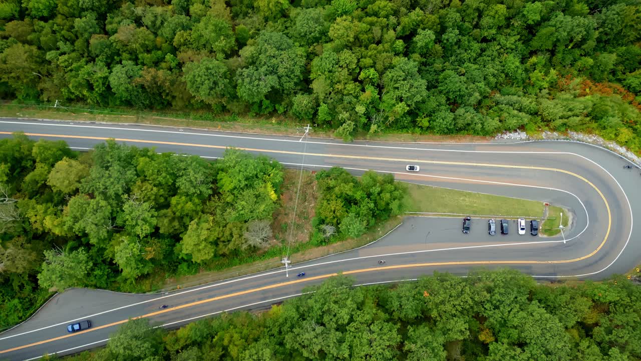 Smooth downward drone fly over Mohawk Trail scenic road at lookout turnaround, Berkshire, Massachusetts, USA