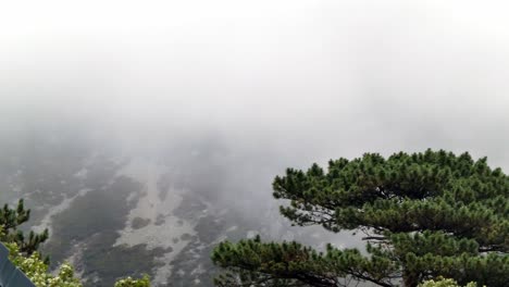 Scenic-Wales-misty-moody-fog-atmosphere-sweeping-across-mountain-countryside