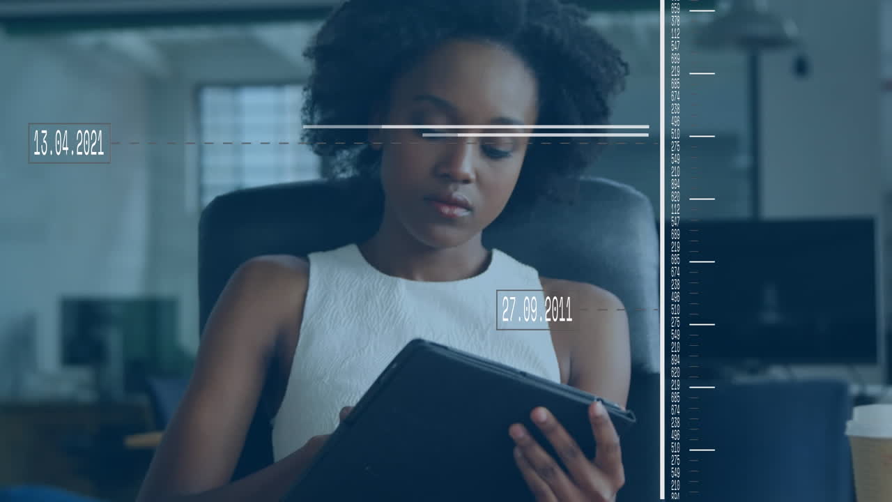 Animation of data processing over african american businesswoman using digital tablet at office