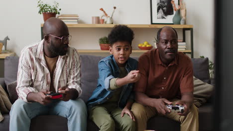 men and boy playing video games