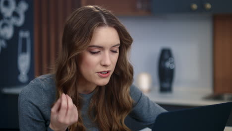 portrait of upset businesswoman talking by video chat