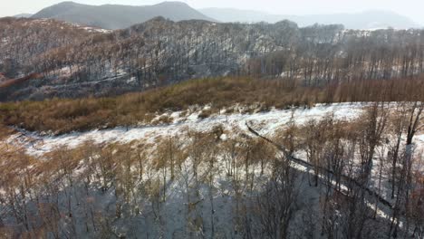 Aerial-shot-of-snowy-mountain-road-1