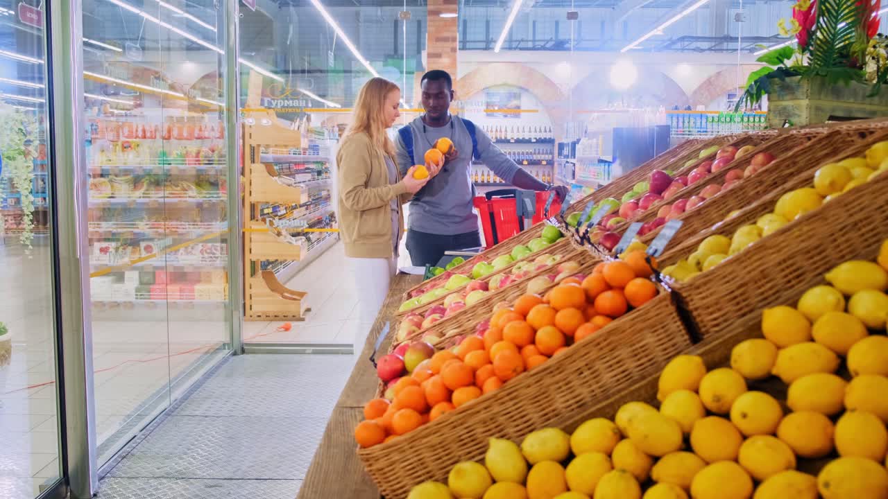 Engaging in Fresh Produce Selection: A Woman and Man Explore Vibrant Fruits at a Supermarket, Choosing the Best Options for Their Meals Together
