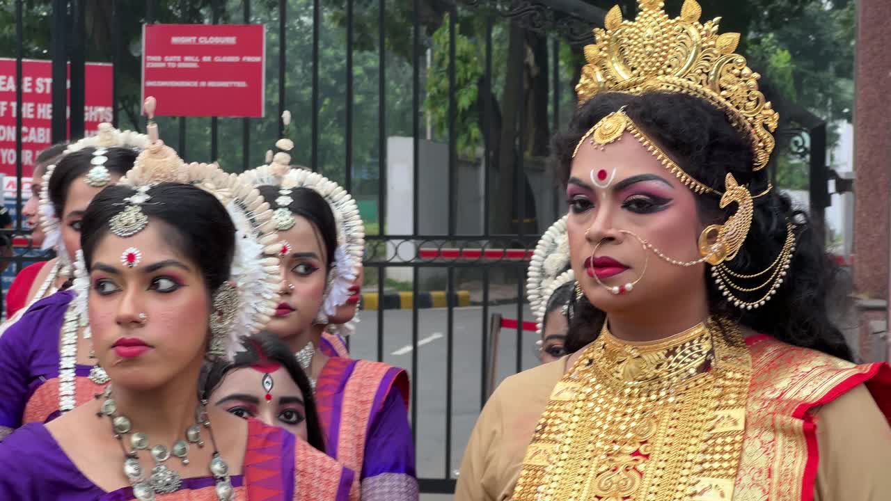 Closeup shot of face of women dressed and make up as Durga Maa during evening in Red Road of Kolkata, India.
