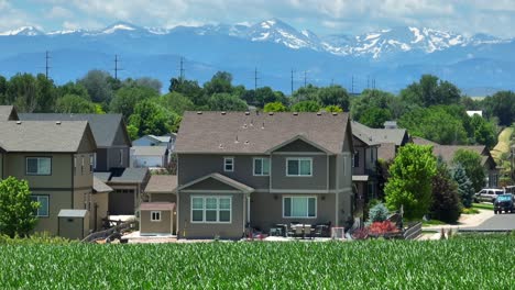 American-home-with-Rocky-Mountains-and-distance-and-corn-field-in-backyard