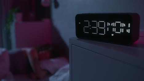 digital clock in a bedroom at night