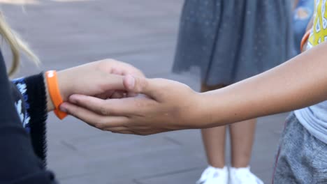 children shake hands with each other