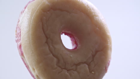 close up shot of a donut spinning vertically in the frame