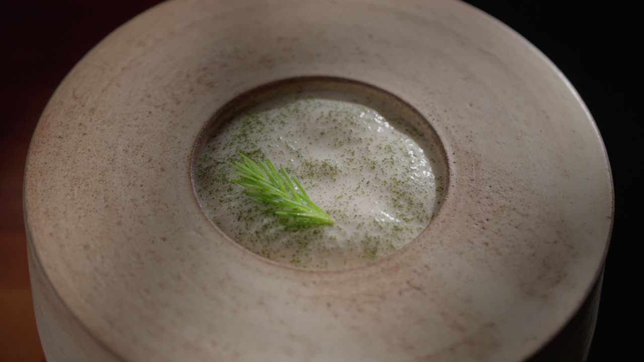 Close-up of Artichoke Soup with White Asparagus and Asparagus Garnish