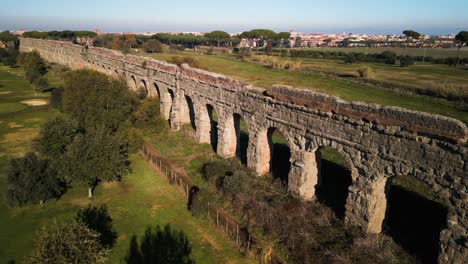 drone flies above claudio aqueduct in rome, italy