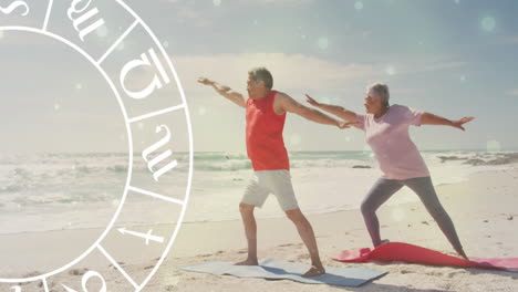 animation of horoscope moving over happy senior biracial couple practicing yoga at beach