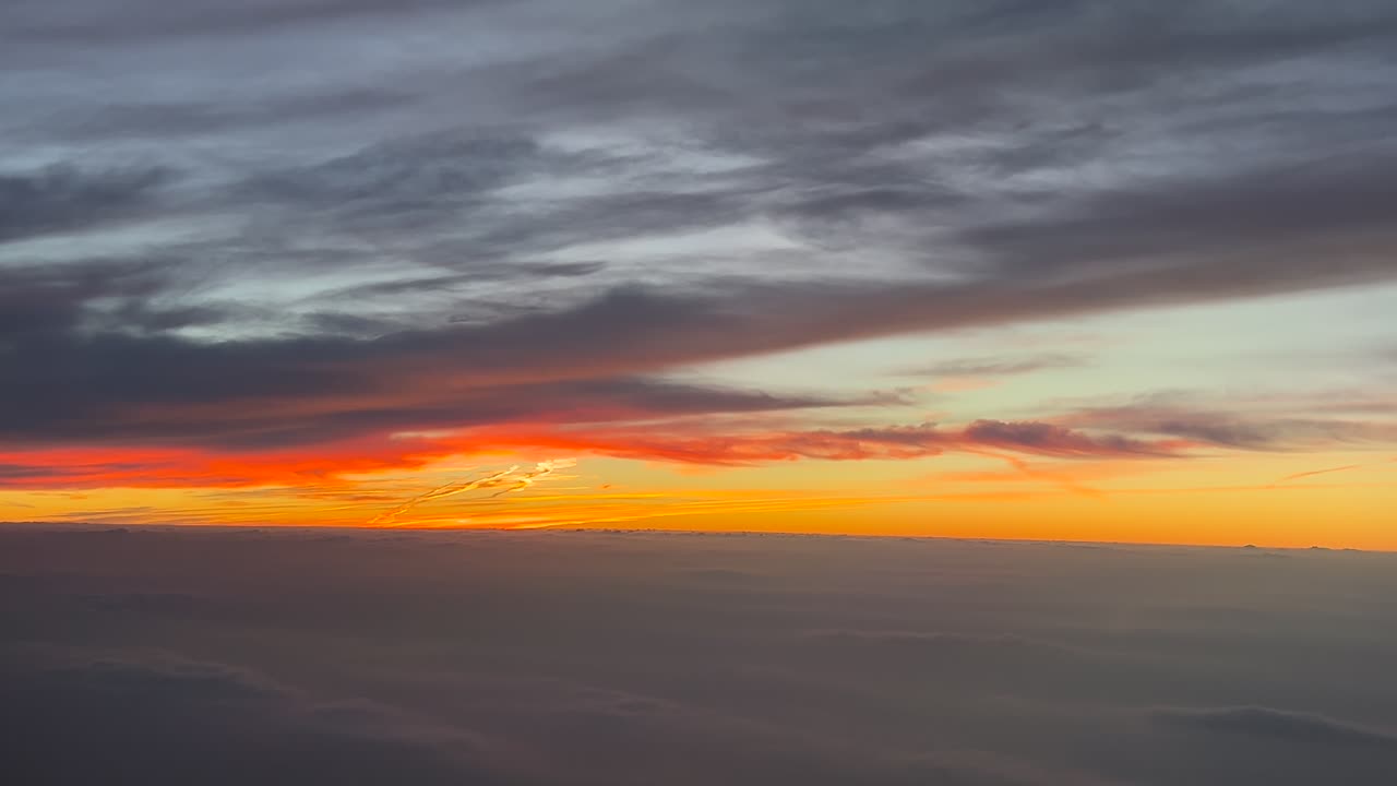 POV flying in a biblical orange sky as seen from the cockpit of an airplane