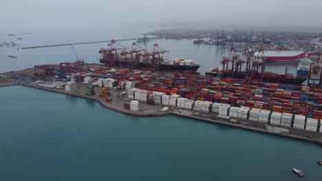 Drone-video-of-a-shipping-container-yard-and-sea-port-of-Callao,-Peru