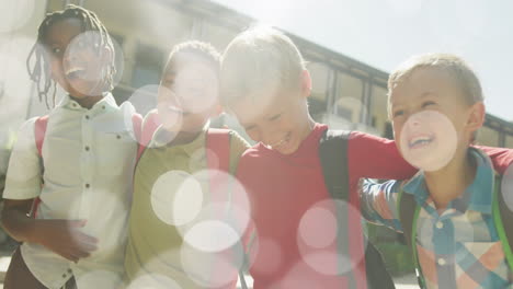animation of bokeh lights over happy diverse schoolboys walking together outside school