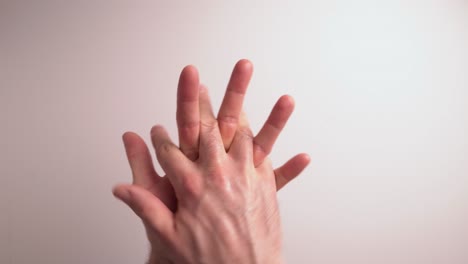 legally advised hand sanitising technique presentation followed by nhs guidelines.  hand sanitising gel has been applied to a white man's hand