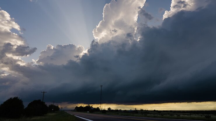 Crepuscular Rays Fill The Sky As A Powerful Storm Builds Overhead