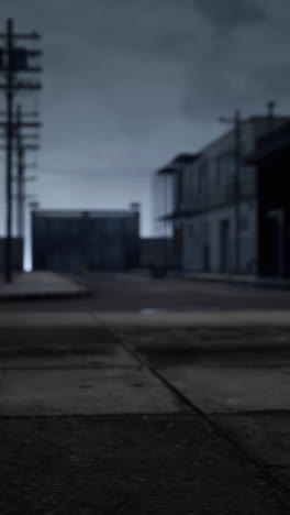 a dark and empty alley in a city at night.