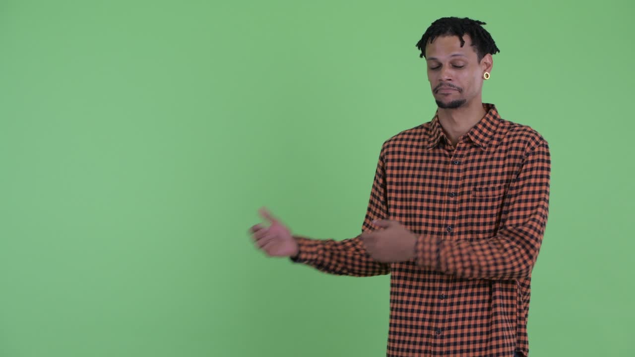 Young handsome African man with dreadlocks