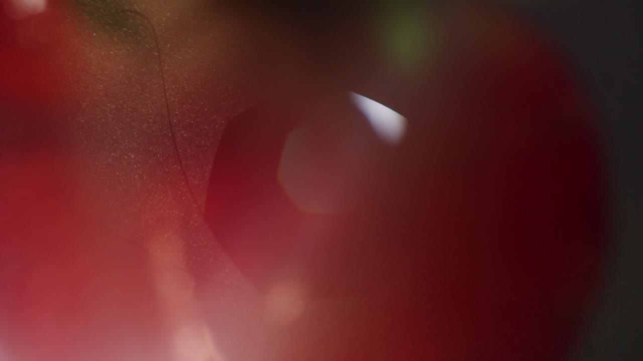Abstract Lens Aperture Opening and Closing with Light Flare