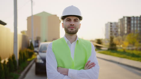portrait of a male construction worker or engineer in a hard hat and safety vest
