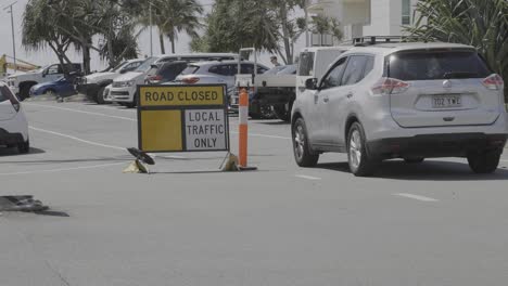 cars navigating road closure at currumbin beach