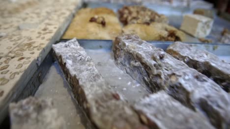 Baked-Pastries-In-Trays-Being-Sold-In-A-Bakery-At-A-Souk-In-Tunis,-Tunisia