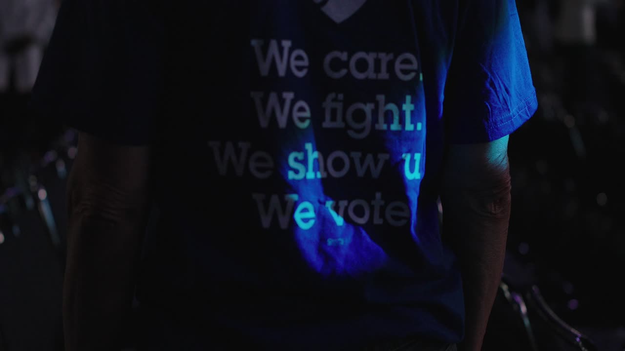 Up close shot of shirt "We, Care - We Fight" shirt at teachers union conference