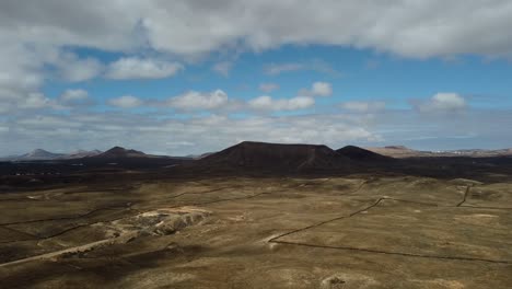 barren and arid nature landscape on the island of lanzarote with volcanic mountains