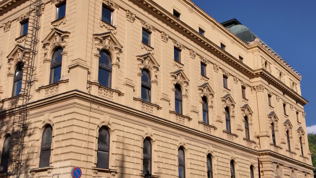Beautiful view of the National Theatre of Szeged, illuminated with warm golden tones that enhance its architectural details