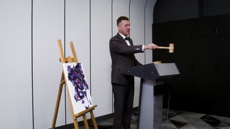 man in elegant suit with gavel