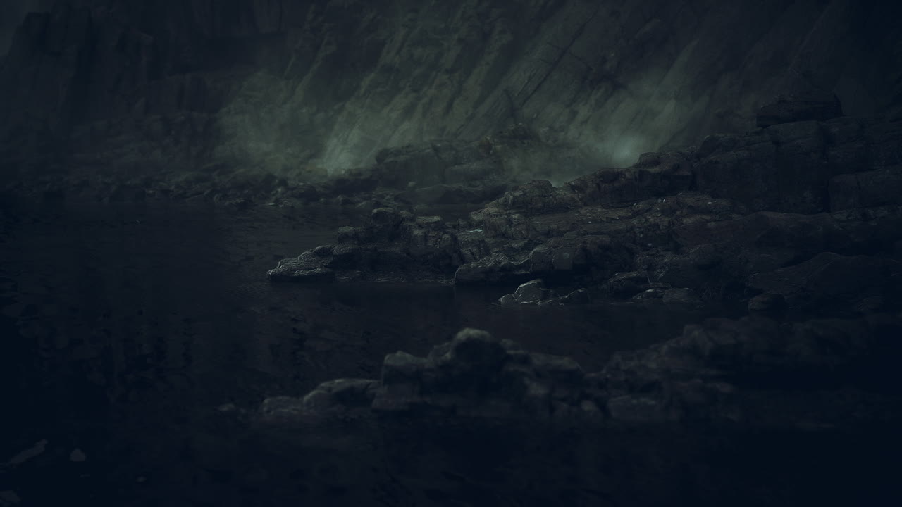 Rocky coastline under dark clouds at dusk near the waters edge