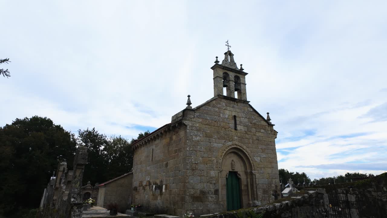 Stone church of San Paio de Albán with surrounding landscape in Coles, Galicia, Spain