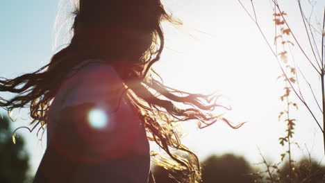 girl with flowing hair in the sun