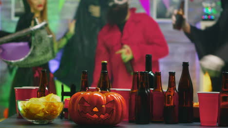 table with chips and beer for group of people