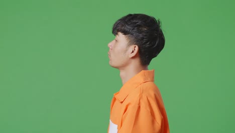 man in orange jumpsuit profile view