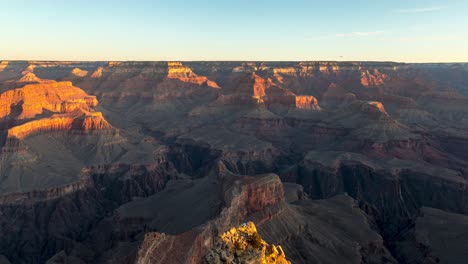 warm sunrise over grand canyon national park in arizona, usa