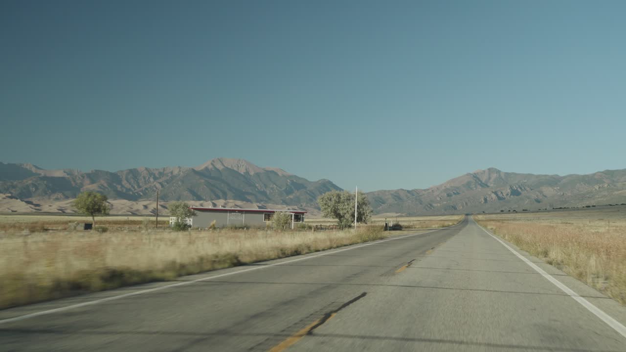 Road trip through a scenic landscape with mountains