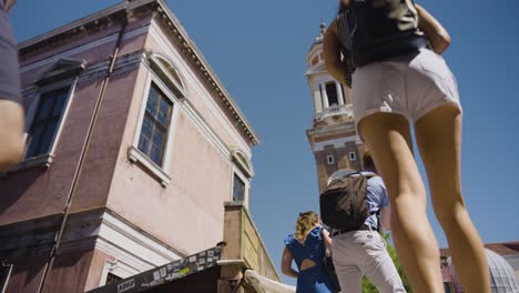 a beautiful shot of a cultural landmark and tourists in venice