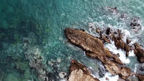 Rocks-in-the-pacific-sea,-uhd-4k-aerial