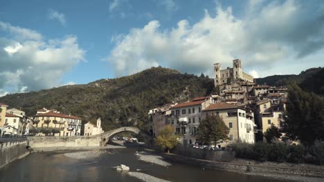 picturesque italian mountain village with river and bridge