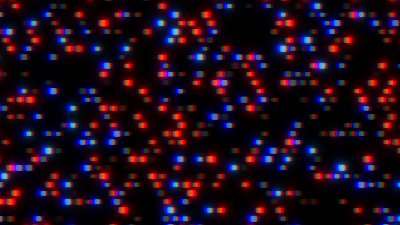 Symmetrical grid of red, blue, and green dots forming a pattern