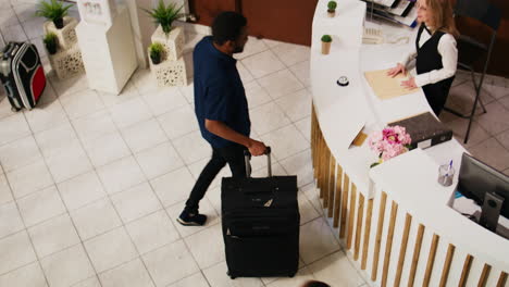 hotel guest entering at reception lobby