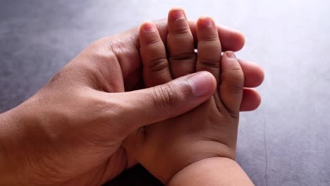 parent and child holding hands