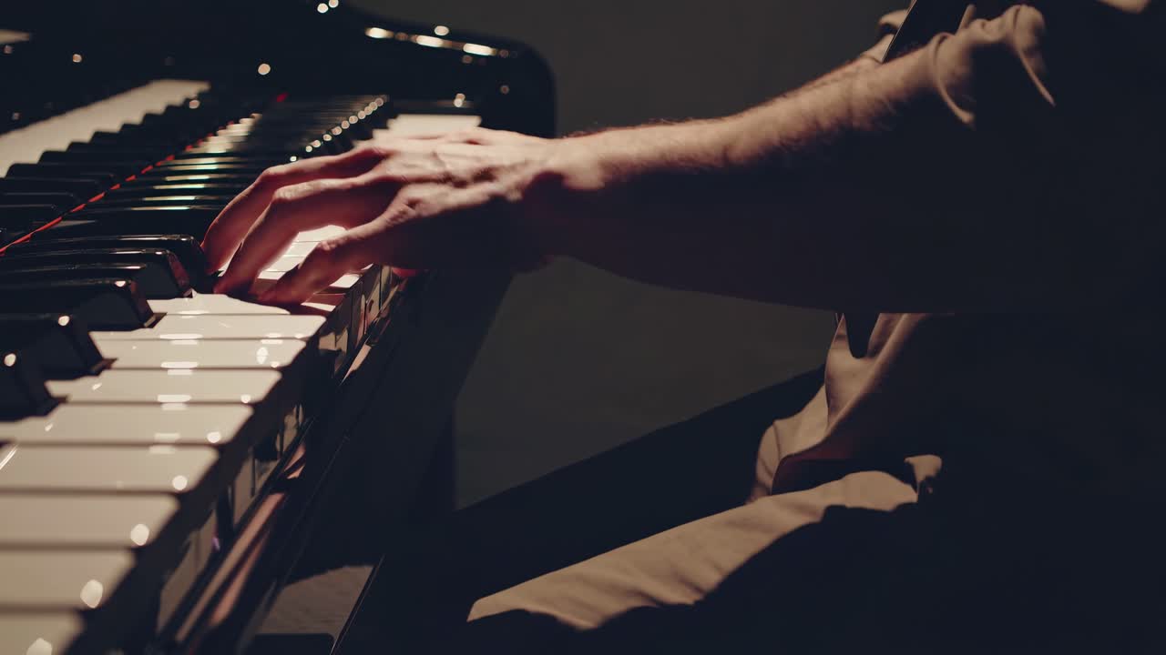 Close-up video of hands playing a piano, capturing the emotion and skill