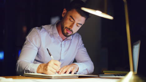 young business man writing