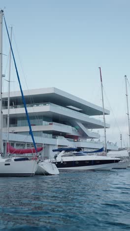 boats in a marina with modern architecture