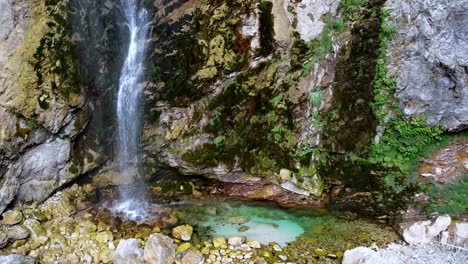 Pan-shot-with-drone-of-waterfall-crystal-clear-water-in-Tamare-park-Albania