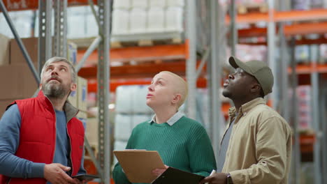 warehouse team inspecting inventory and stock